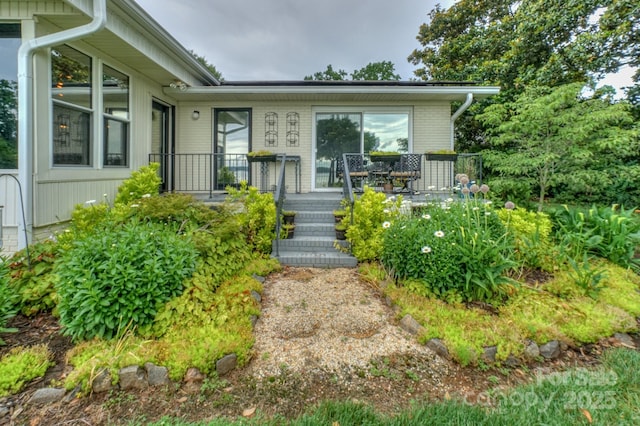 7945 Placid Ct, Denver, NC 28037 - view of front facade with a deck and brick siding