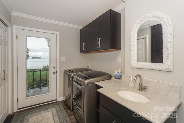 7945 Placid Ct, Denver, NC 28037 - washroom with washer and clothes dryer, ornamental molding, cabinet space, dark wood-type flooring, and a water view