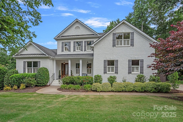 109 Walking Horse Trl, Davidson, NC 28036 - view of front of property with a porch, a front lawn, and brick siding