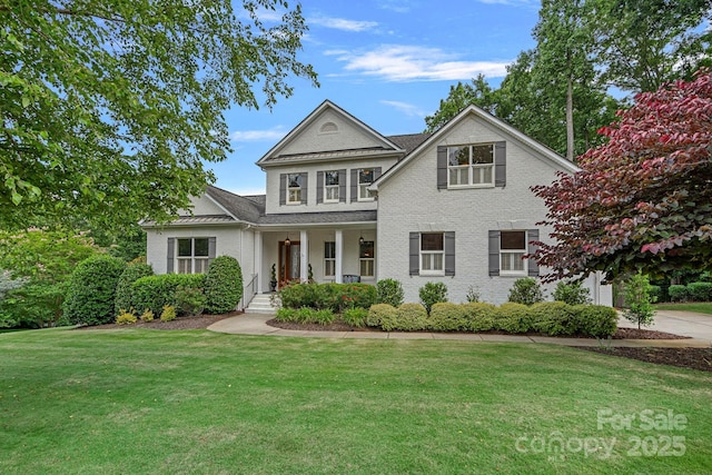 109 Walking Horse Trl, Davidson, NC 28036 - view of front facade featuring covered porch, a front yard, and brick siding