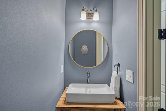 109 Walking Horse Trl, Davidson, NC 28036 - bathroom featuring a textured wall and vanity