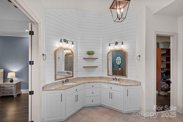 109 Walking Horse Trl, Davidson, NC 28036 - bathroom featuring double vanity and a walk in closet