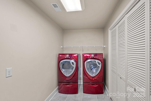 109 Walking Horse Trl, Davidson, NC 28036 - laundry room with washing machine and dryer and tile patterned flooring