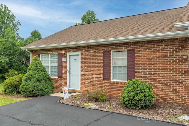 130 24th St NW, Hickory, NC 28601 - view of front of house featuring brick siding and roof with shingles