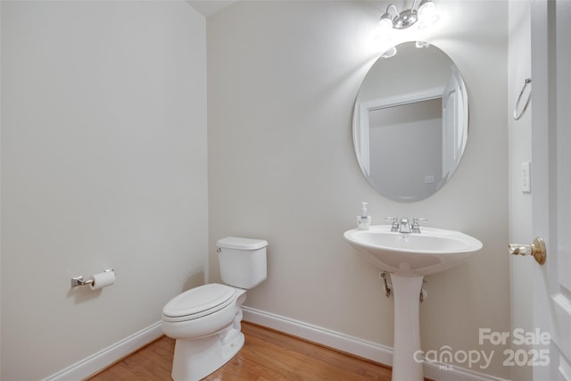 5008 Woodview Ln, Weddington, NC 28104 - bathroom featuring wood finished floors, toilet, and baseboards