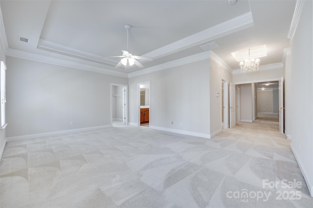 5008 Woodview Ln, Weddington, NC 28104 - spare room with ornamental molding, a tray ceiling, a chandelier, and light colored carpet