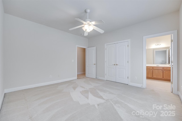 5008 Woodview Ln, Weddington, NC 28104 - unfurnished bedroom featuring light carpet, a closet, baseboards, ensuite bathroom, and ceiling fan