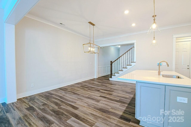 4714 Blanchard Way, Charlotte, NC 28226 - bar area featuring a sink, dark wood-style flooring, crown molding, stairway, and decorative light fixtures