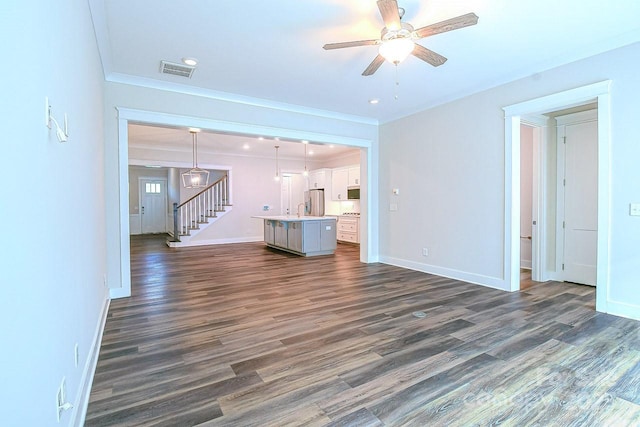 4714 Blanchard Way, Charlotte, NC 28226 - unfurnished living room with a ceiling fan, dark wood-style flooring, baseboards, ornamental molding, and stairway