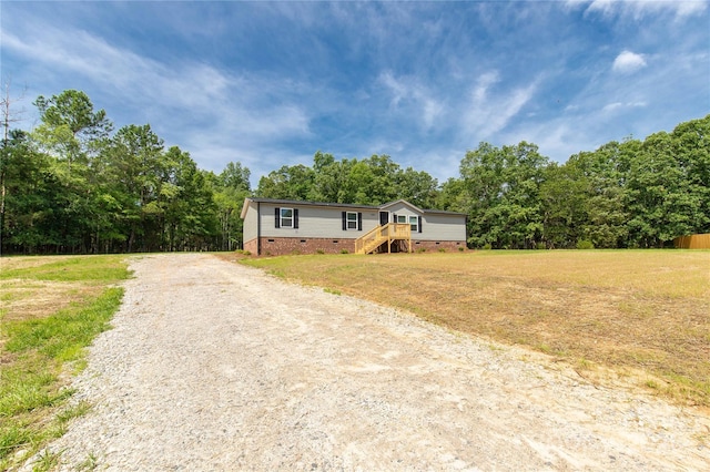 2007 Sugar Hill Rd, York, SC 29745 - manufactured / mobile home with crawl space, driveway, a front yard, and a wooded view