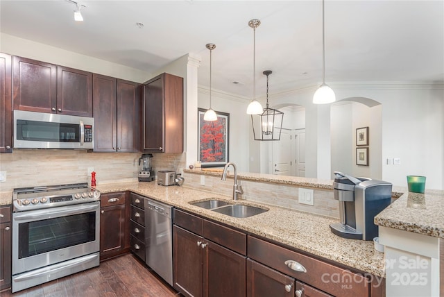 5 Farleigh St Unit 303, Asheville, NC 28803 - kitchen with stainless steel appliances, arched walkways, decorative backsplash, a peninsula, and dark brown cabinets