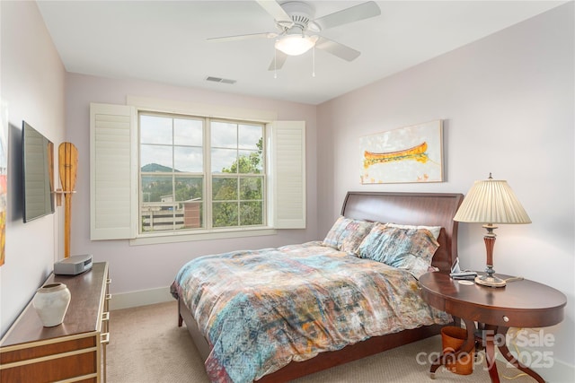 5 Farleigh St Unit 303, Asheville, NC 28803 - carpeted bedroom featuring baseboards and a ceiling fan
