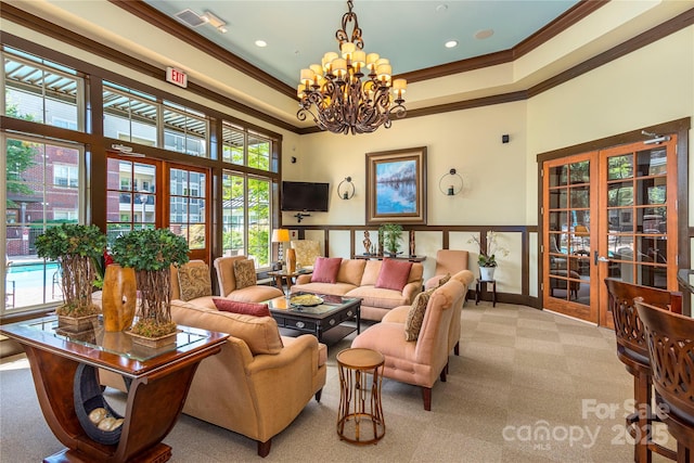 5 Farleigh St Unit 303, Asheville, NC 28803 - carpeted living room with ornamental molding, healthy amount of natural light, a chandelier, a tray ceiling, and recessed lighting