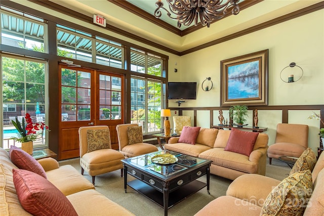 5 Farleigh St Unit 303, Asheville, NC 28803 - carpeted living room with a chandelier and ornamental molding