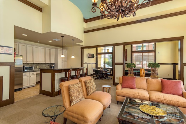 5 Farleigh St Unit 303, Asheville, NC 28803 - living room with a chandelier, light colored carpet, a towering ceiling, recessed lighting, and light tile patterned floors