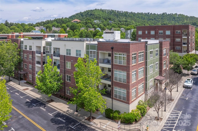 5 Farleigh St Unit 303, Asheville, NC 28803 - view of apartment building / complex featuring uncovered parking