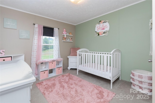 600 Old Mars Hill Hwy, Weaverville, NC 28787 - carpeted bedroom with crown molding, a nursery area, and a textured ceiling