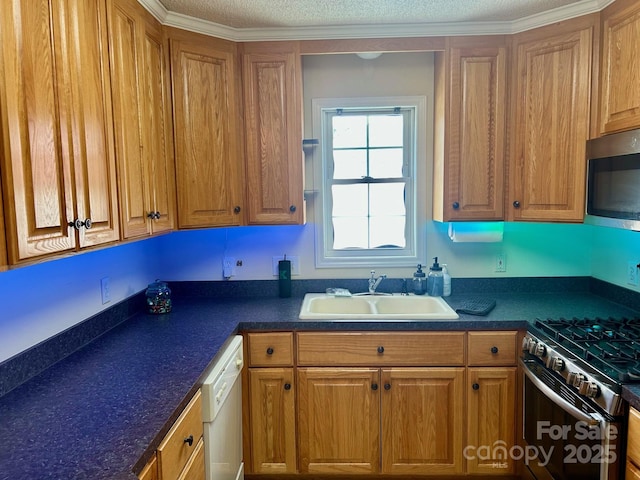 1700 Pickwick Ave, Kannapolis, NC 28083 - kitchen with a sink, appliances with stainless steel finishes, dark countertops, and brown cabinets