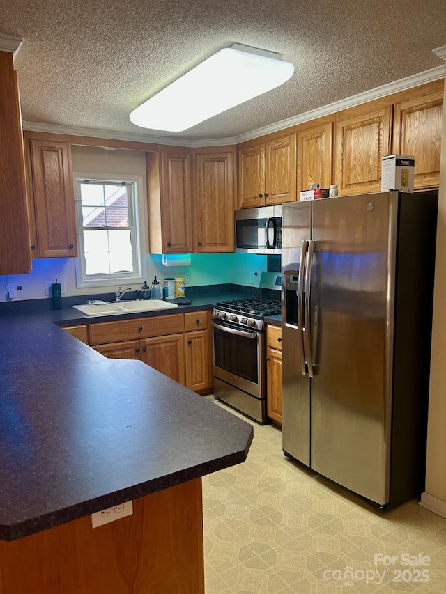 1700 Pickwick Ave, Kannapolis, NC 28083 - kitchen with stainless steel appliances, a sink, dark countertops, a textured ceiling, and brown cabinets
