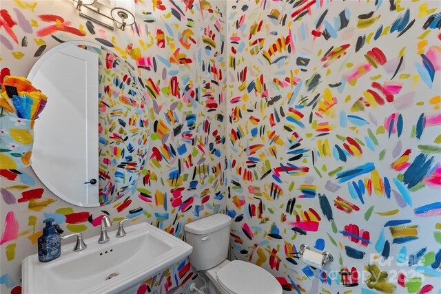 318 N Dotger Ave, Charlotte, NC 28204 - bathroom with a sink and wallpapered walls