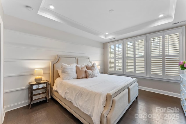 318 N Dotger Ave, Charlotte, NC 28204 - bedroom with a raised ceiling, recessed lighting, and dark wood-type flooring
