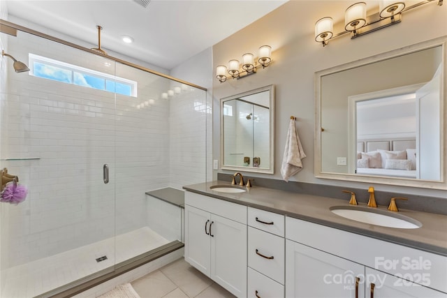 318 N Dotger Ave, Charlotte, NC 28204 - full bath with double vanity, a shower stall, tile patterned flooring, and ensuite bathroom