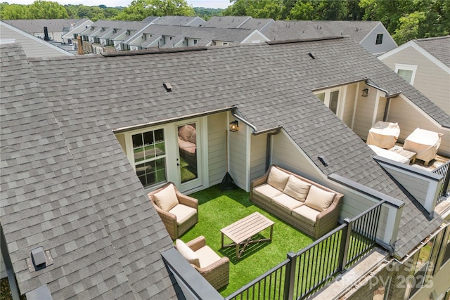 318 N Dotger Ave, Charlotte, NC 28204 - back of property with an outdoor living space, a shingled roof, and a residential view