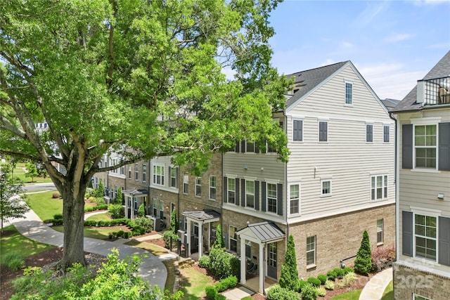 318 N Dotger Ave, Charlotte, NC 28204 - rear view of house with brick siding