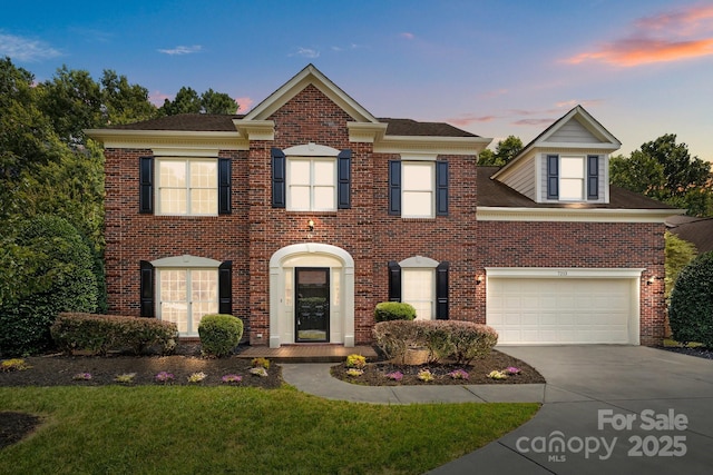 7213 Baniff Cir, Charlotte, NC 28277 - colonial house featuring driveway, brick siding, and a front lawn