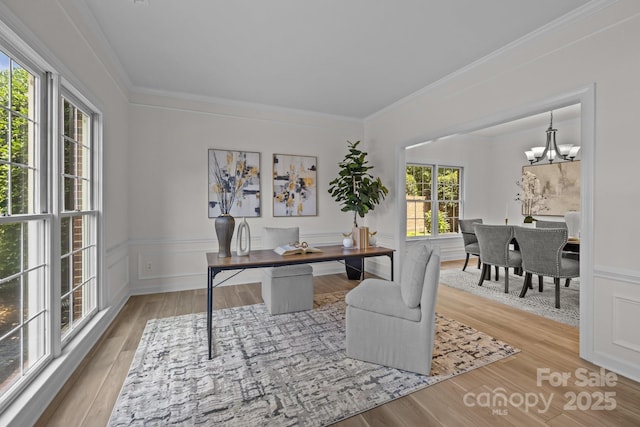 7213 Baniff Cir, Charlotte, NC 28277 - home office with wood finished floors, a chandelier, ornamental molding, and a wainscoted wall