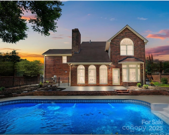 7213 Baniff Cir, Charlotte, NC 28277 - pool at dusk with a patio area