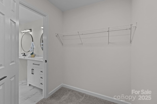 7213 Baniff Cir, Charlotte, NC 28277 - walk in closet featuring light marble finish flooring