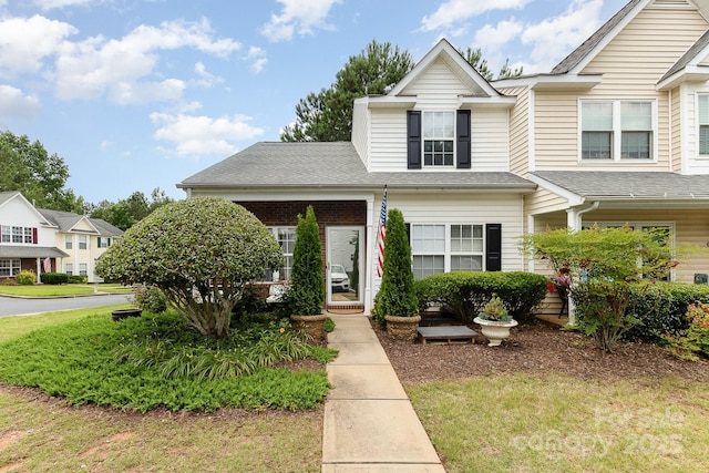 6103 Warrior Ave, Fort Mill, SC 29707 - view of front facade with a front lawn and roof with shingles