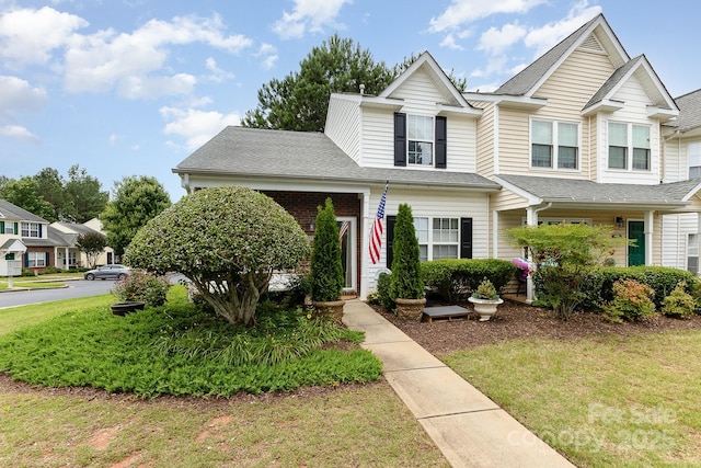 6103 Warrior Ave, Fort Mill, SC 29707 - view of front facade featuring a front lawn and roof with shingles