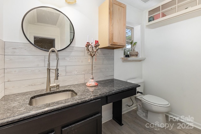 6103 Warrior Ave, Fort Mill, SC 29707 - half bath featuring vanity, wood finished floors, and backsplash