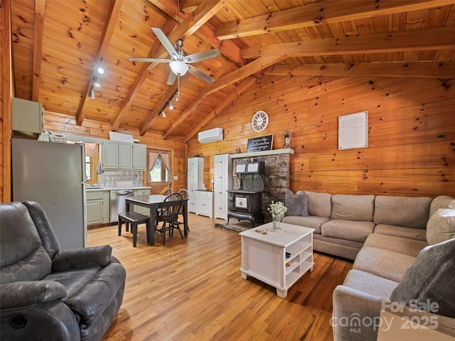 367 Robinson Rd, Clyde, NC 28721 - living area featuring wooden ceiling, wooden walls, rail lighting, light wood-style flooring, and ceiling fan
