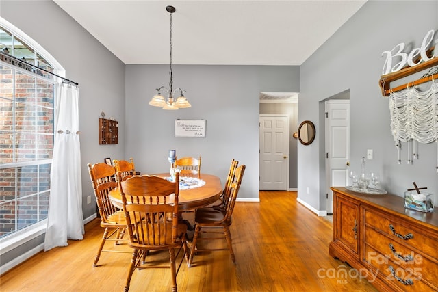 256 Rose St, Mooresville, NC 28117 - dining area with light wood-type flooring and a chandelier