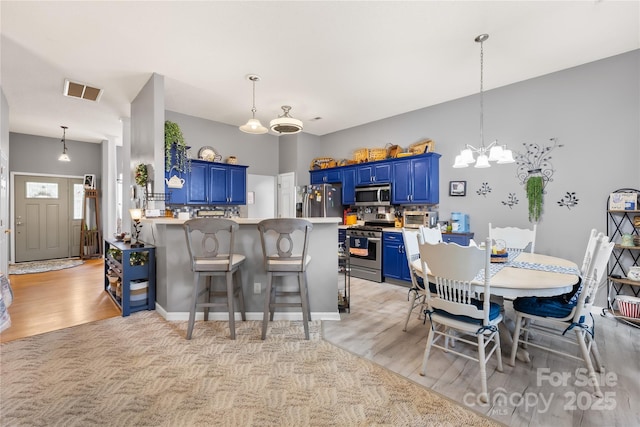 256 Rose St, Mooresville, NC 28117 - dining space with a chandelier and light wood finished floors