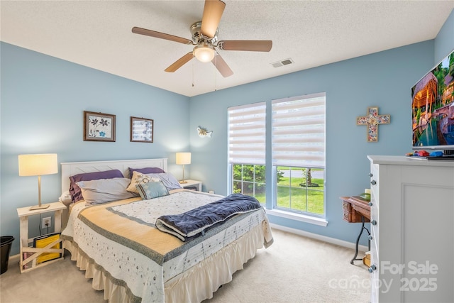 256 Rose St, Mooresville, NC 28117 - bedroom with light carpet, a ceiling fan, and a textured ceiling