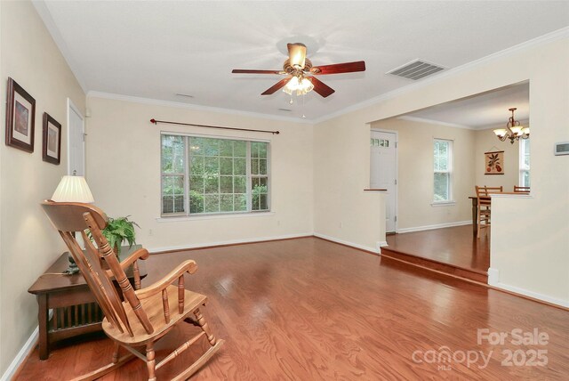 4263 Melrose Club Dr, Matthews, NC 28105 - sitting room featuring wood finished floors, a chandelier, ceiling fan, and crown molding