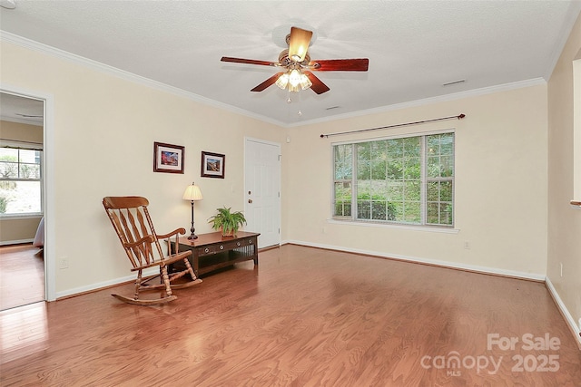4263 Melrose Club Dr, Matthews, NC 28105 - sitting room featuring wood finished floors, crown molding, a ceiling fan, and a textured ceiling