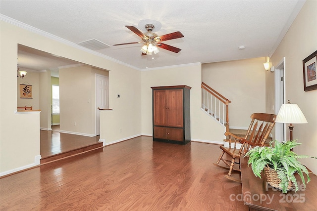 4263 Melrose Club Dr, Matthews, NC 28105 - living area with wood finished floors, ceiling fan, stairway, ornamental molding, and a textured ceiling