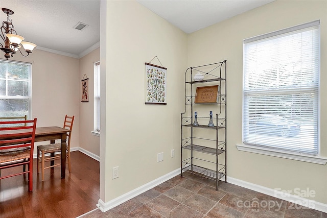 4263 Melrose Club Dr, Matthews, NC 28105 - dining area with a chandelier and crown molding