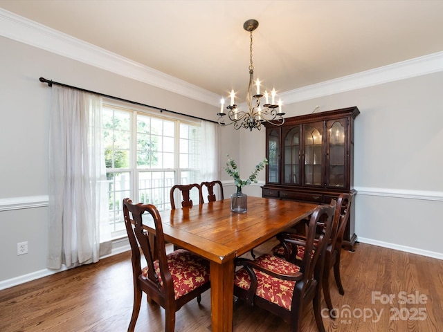 1423 Piper Ct, Concord, NC 28025 - dining room featuring a chandelier, crown molding, and wood finished floors