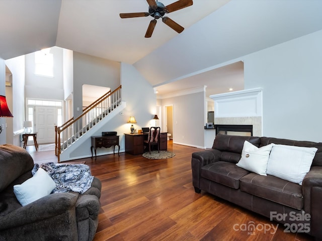 1423 Piper Ct, Concord, NC 28025 - living area featuring stairway, a ceiling fan, wood finished floors, vaulted ceiling, and a tile fireplace