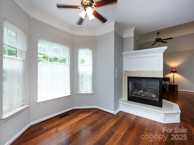 1423 Piper Ct, Concord, NC 28025 - unfurnished living room featuring a ceiling fan, wood finished floors, and a multi sided fireplace