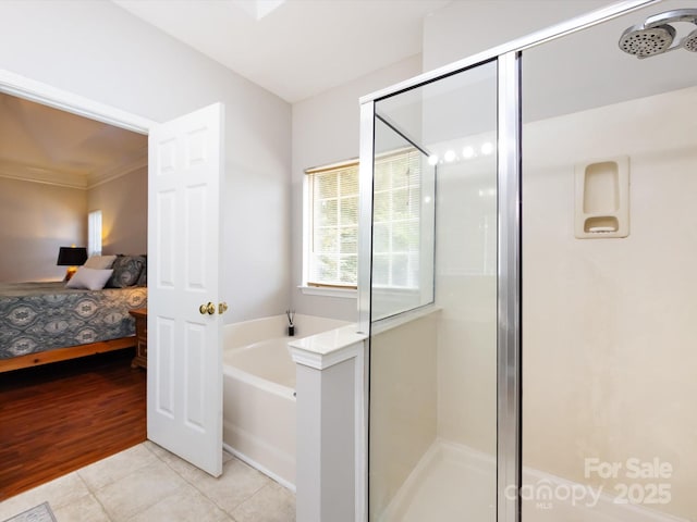 1423 Piper Ct, Concord, NC 28025 - bathroom featuring ensuite bath, a garden tub, a shower stall, and tile patterned floors