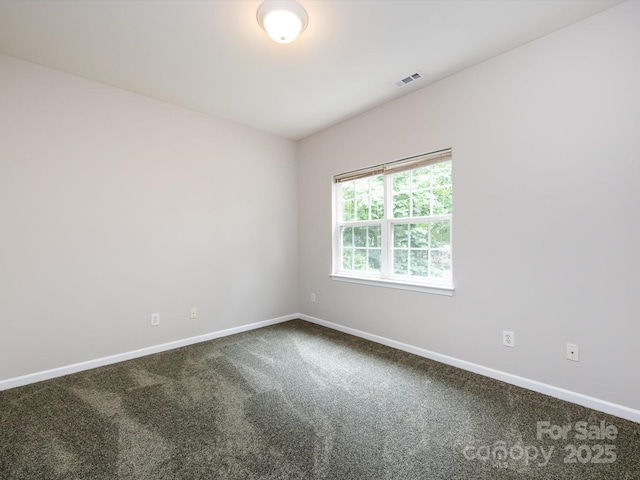1423 Piper Ct, Concord, NC 28025 - spare room with baseboards and dark carpet