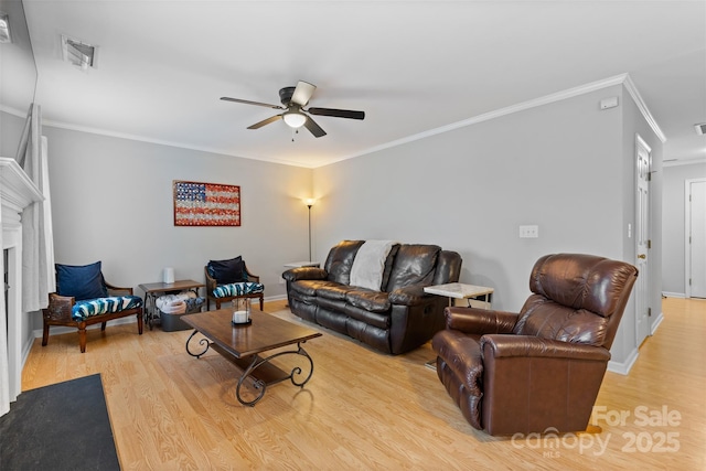 9637 Brookmere Ln, Charlotte, NC 28214 - living room featuring ceiling fan, light wood-type flooring, a fireplace, ornamental molding, and baseboards
