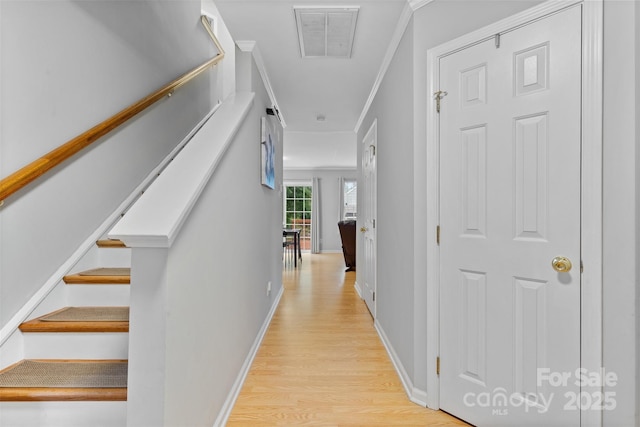9637 Brookmere Ln, Charlotte, NC 28214 - hallway with light wood-type flooring, crown molding, and baseboards